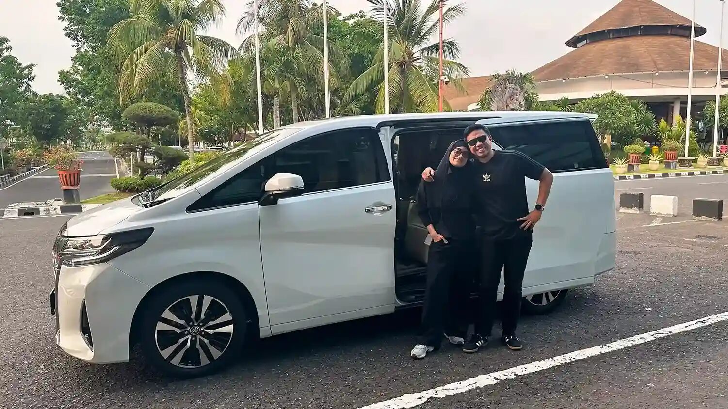 Our coordinator and driver with the airport transfer van in Bali